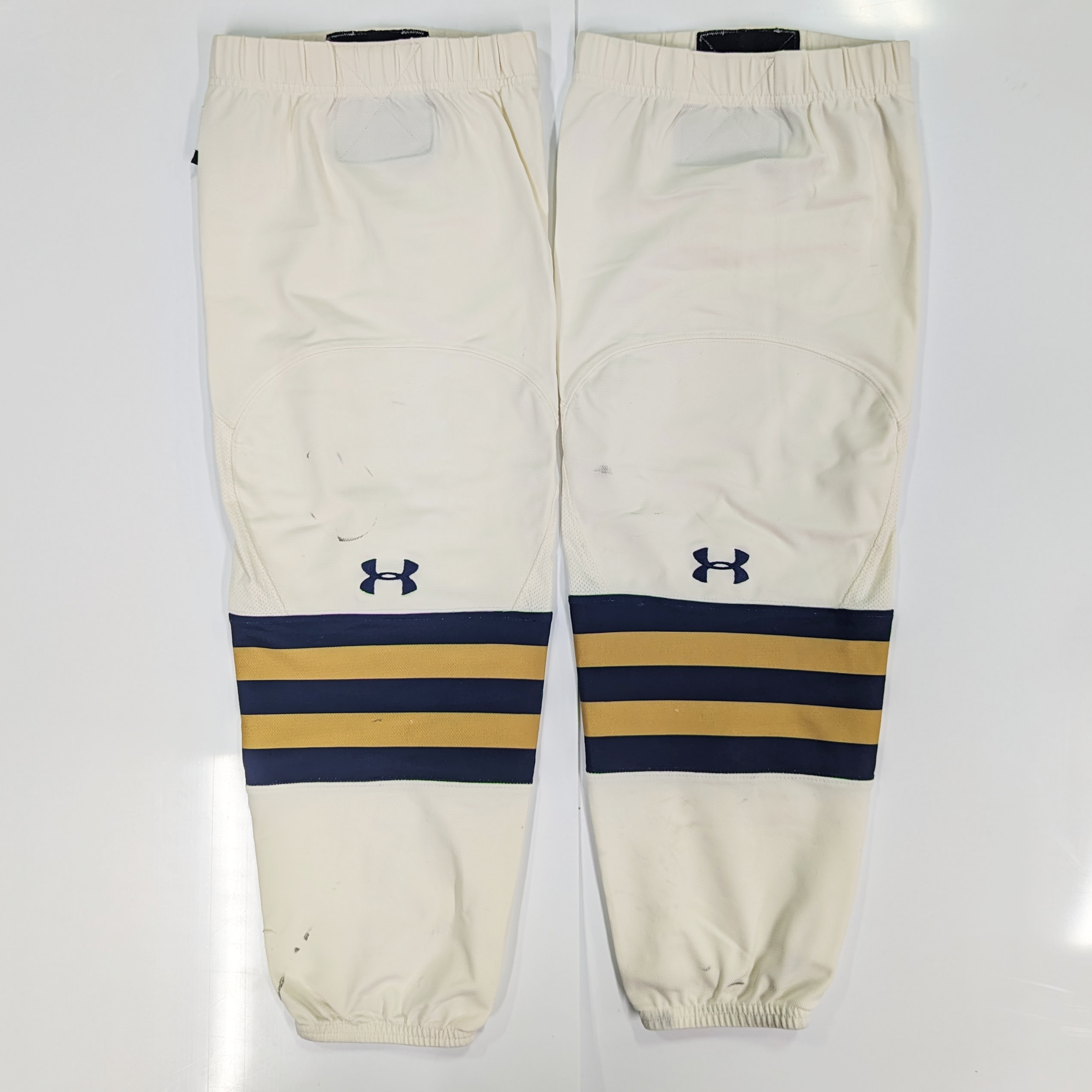 NCAA - Chaussettes de hockey Under Armour d'occasion (crème/bleu marine/or)